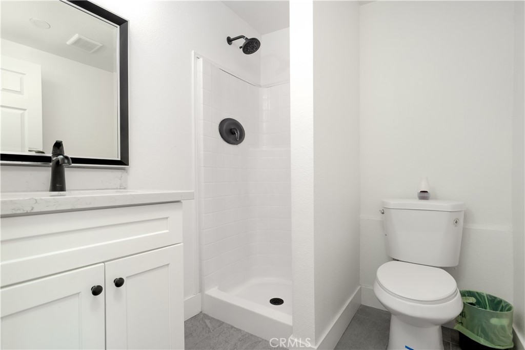 38859 Mesquite Road Palmdale, CA 93551 - Photo 20 of 36 a bathroom with a toilet sink and shower