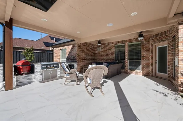 a balcony with furniture and a rug