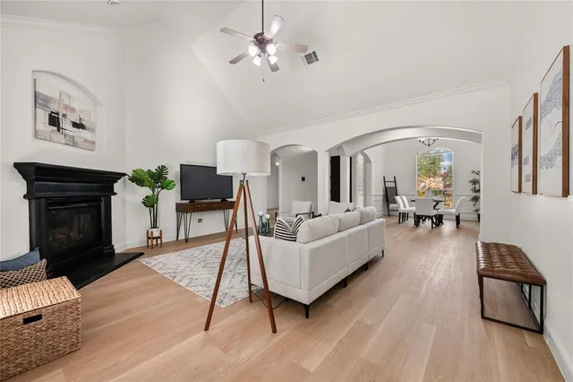 a living room with furniture and a fireplace