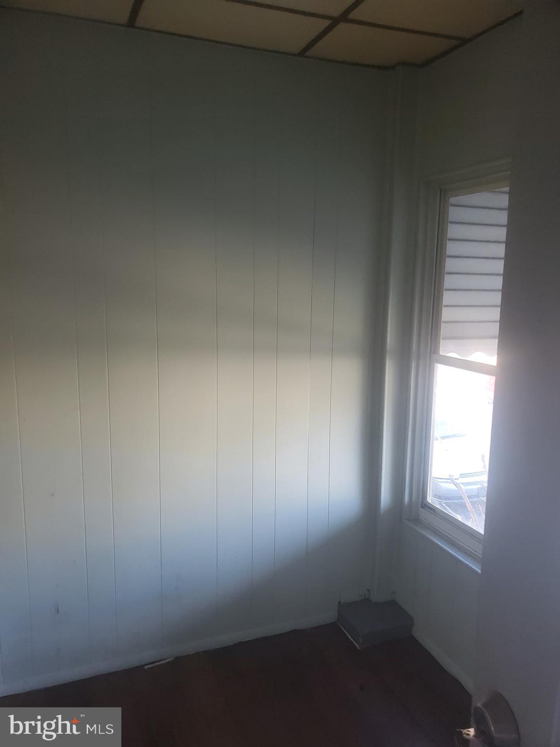 7018 Aberdeen Road Upper Darby, PA 19082 - Photo 2 of 8 an empty room with a window