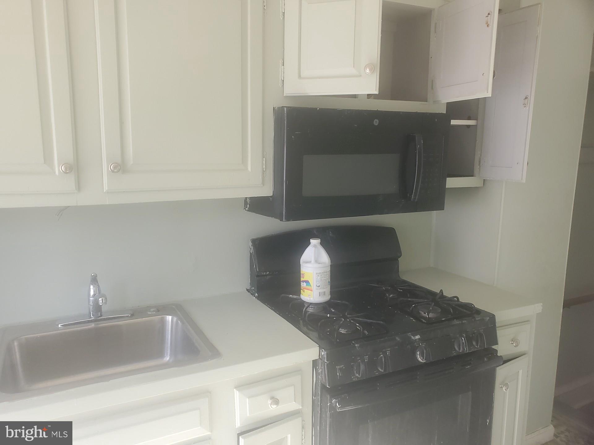 7018 Aberdeen Road Upper Darby, PA 19082 - Photo 4 of 8 a kitchen with a sink and cabinets