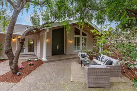 a backyard of a house with seating space