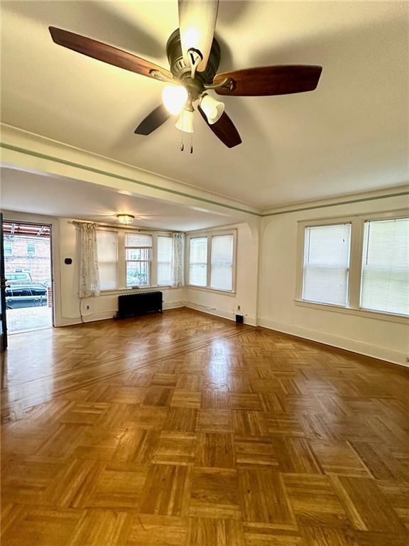 9111 Colonial Road Brooklyn, NY 11209 - Photo 2 of 15 a view of empty room with wooden floor and fan