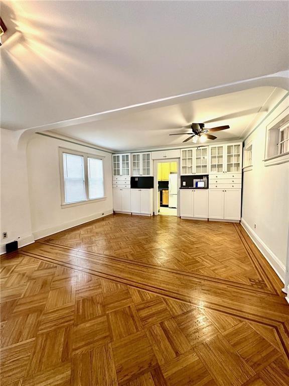 9111 Colonial Road Brooklyn, NY 11209 - Photo 5 of 15 a view of empty room with wooden floor and white walls