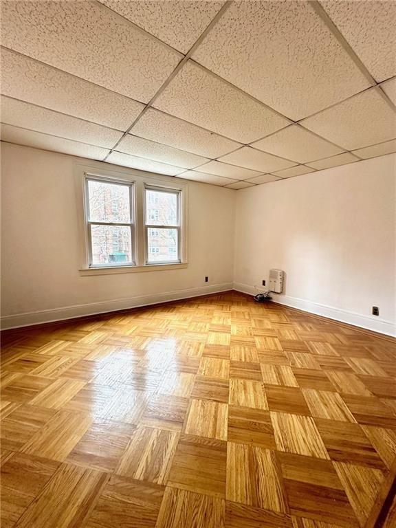 9111 Colonial Road Brooklyn, NY 11209 - Photo 6 of 15 a view of an empty room with a window