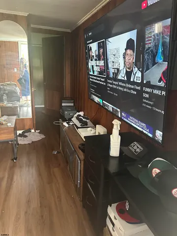 a living room with furniture and next to a window