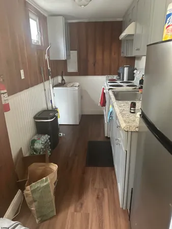 a kitchen with a sink stove and refrigerator