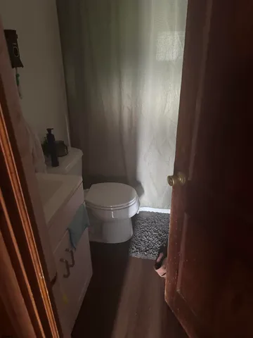 a view of a room with gym equipment and windows