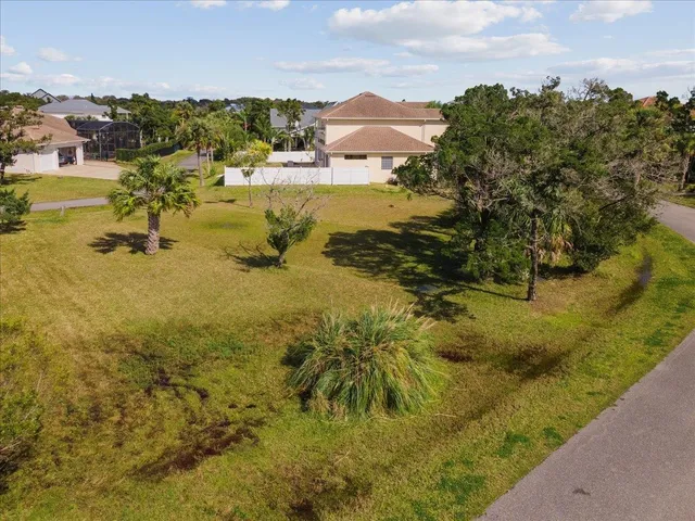a view of a swimming pool with a yard