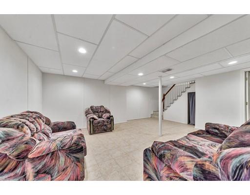 106 Fallston Street Springfield, MA 01119 - Photo 12 of 14 a bed room with a bed and a couch