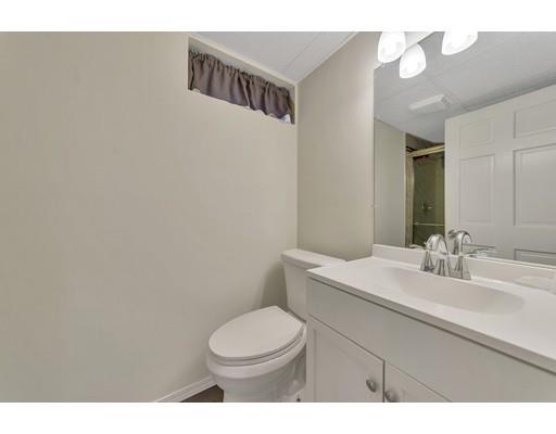 106 Fallston Street Springfield, MA 01119 - Photo 7 of 14 a bathroom with a sink mirror vanity and toilet
