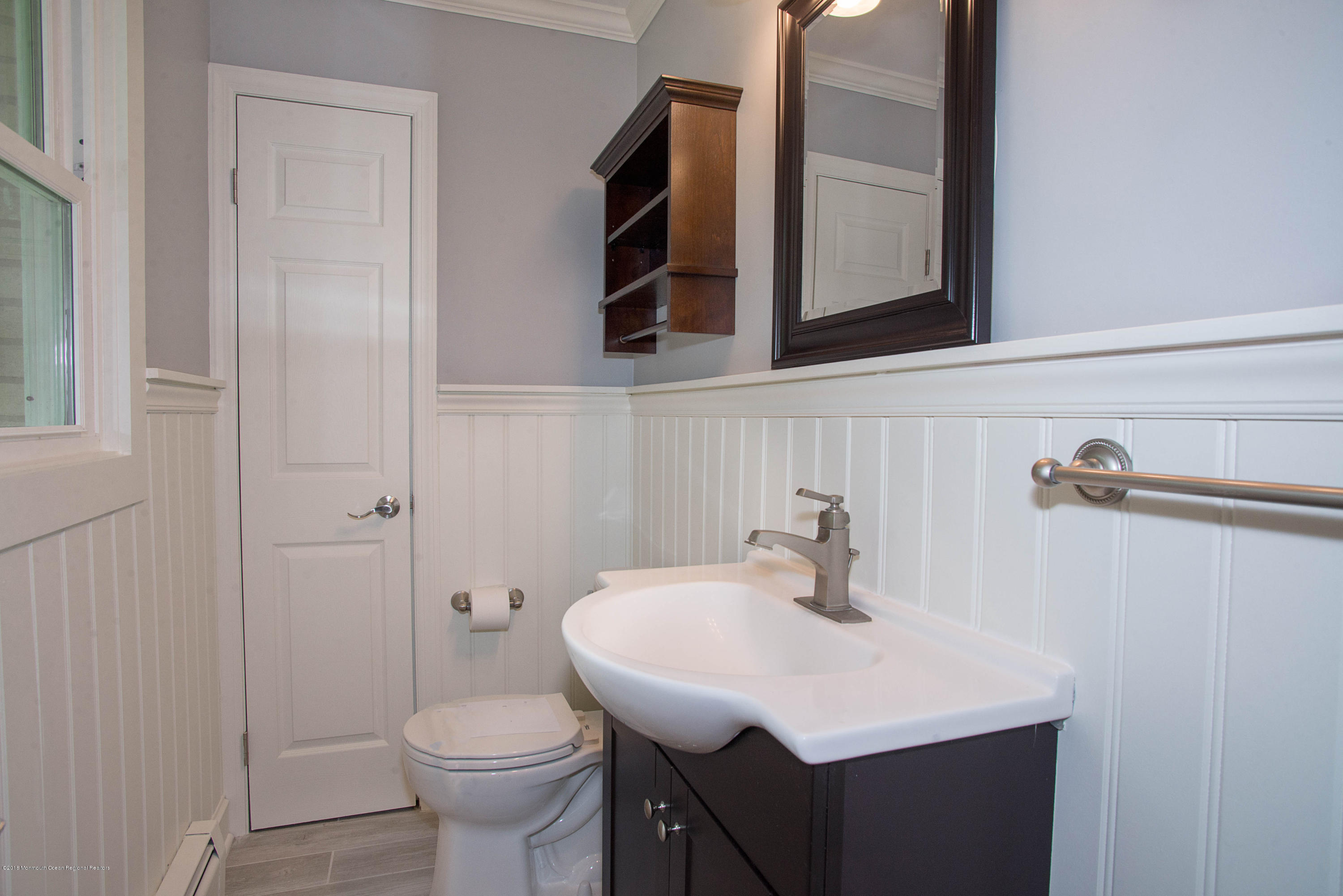 435 Burlington Road Freehold, NJ 07728 - Photo 14 of 24 a bathroom with a sink toilet and mirror