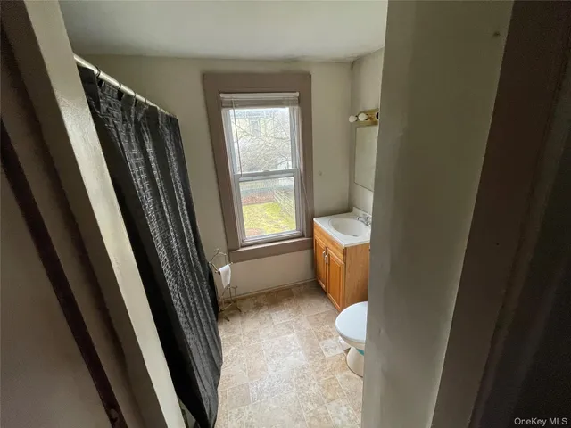 a bathroom with a toilet sink and a shower