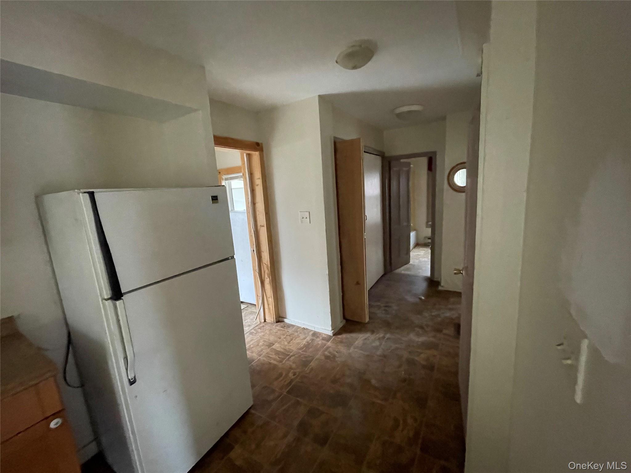 865 North Branch Road Callicoon, NY 12766 - Photo 4 of 15 a view of a hallway with a refrigerator