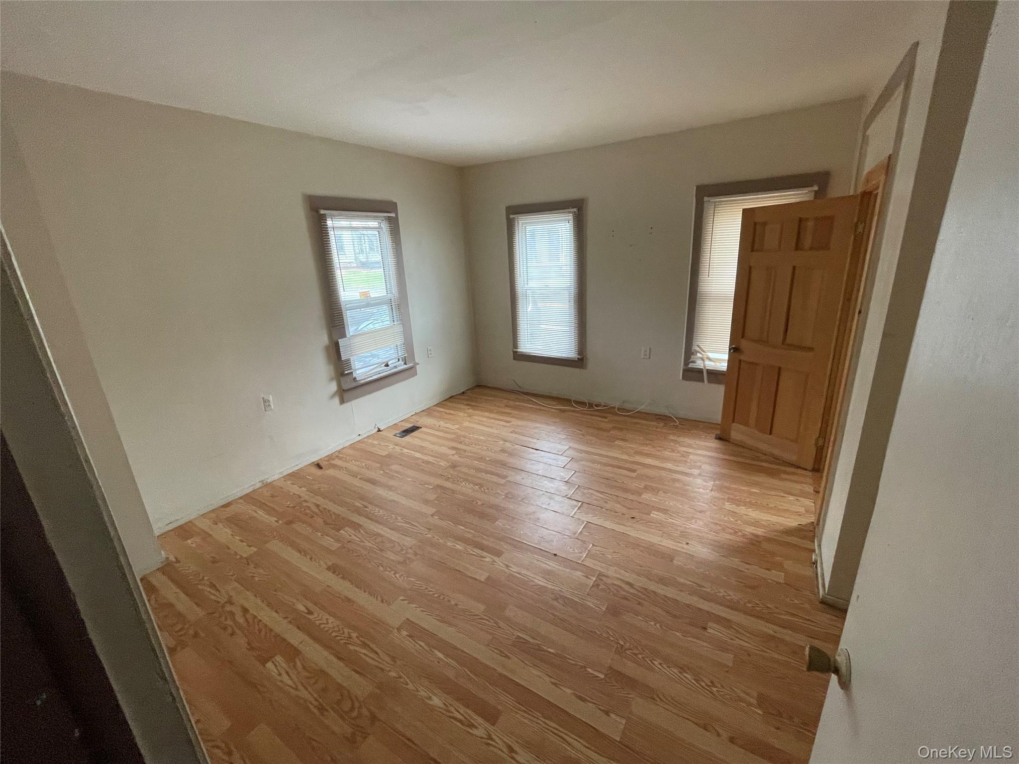 865 North Branch Road Callicoon, NY 12766 - Photo 7 of 15 a view of an empty room with wooden floor and a window