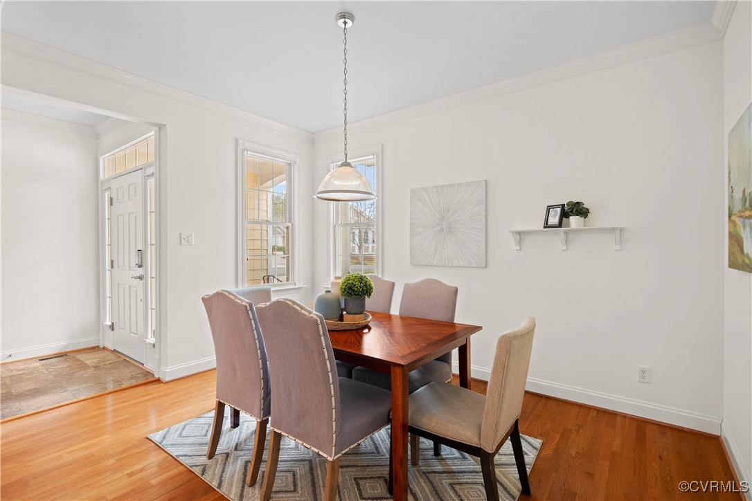 9037 Amberhill Loop Chesterfield, VA 23236 - Photo 15 of 47 a view of a dining room with furniture window and wooden floor