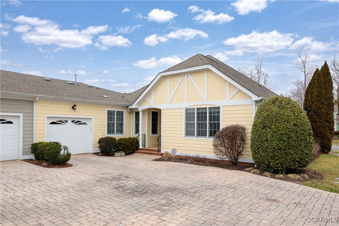 9037 Amberhill Loop Chesterfield, VA 23236 - Photo 2 of 47 a view of backyard with potted plants and a chair