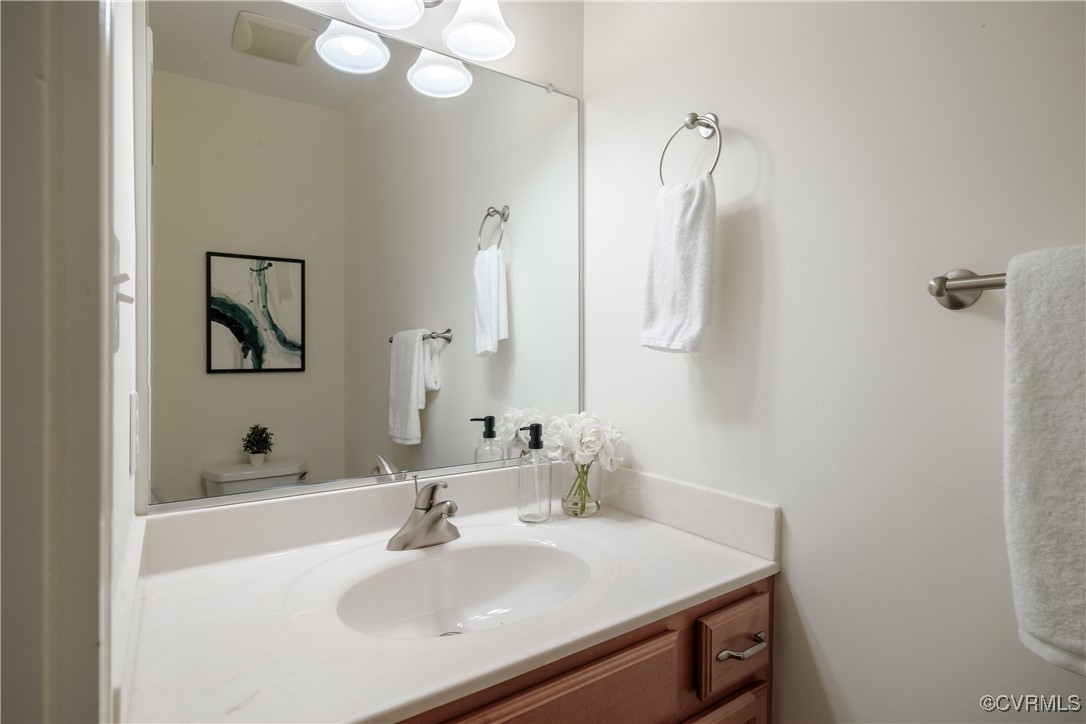 9037 Amberhill Loop Chesterfield, VA 23236 - Photo 24 of 47 a bathroom with a sink vanity and a mirror