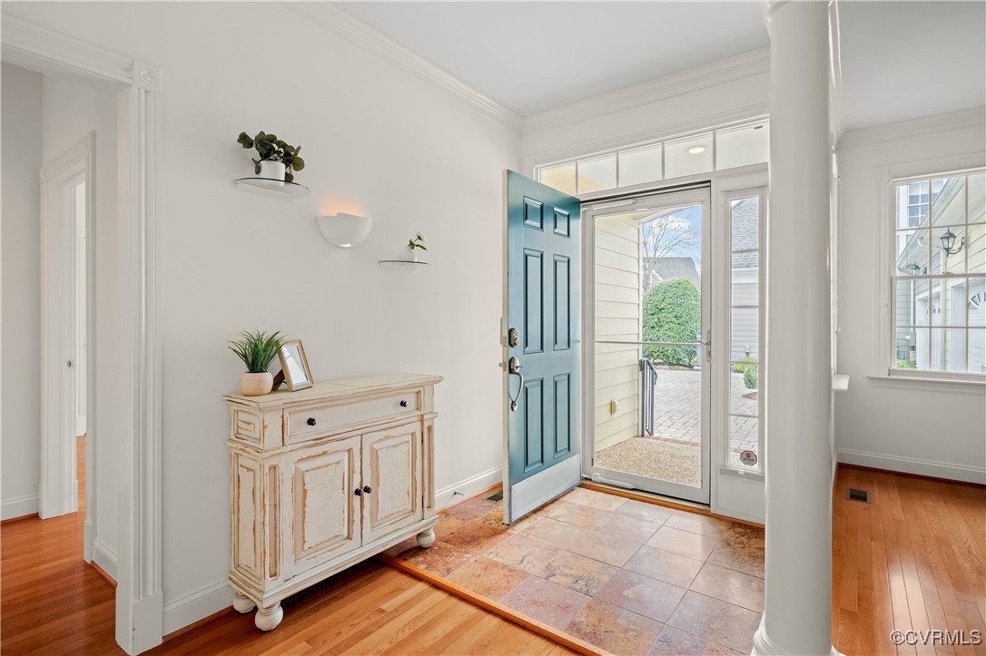 9037 Amberhill Loop Chesterfield, VA 23236 - Photo 8 of 47 a view of a hallway with wooden floor and cabinet