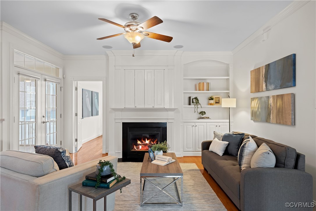 9037 Amberhill Loop Chesterfield, VA 23236 - Photo 9 of 47 a living room with furniture a fireplace and a flat screen tv