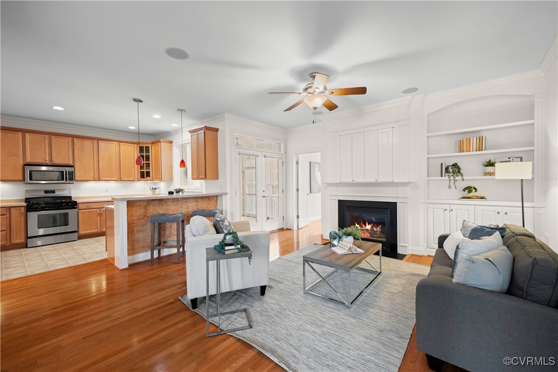 9037 Amberhill Loop Chesterfield, VA 23236 - Photo 10 of 47 a living room with furniture fireplace and kitchen view