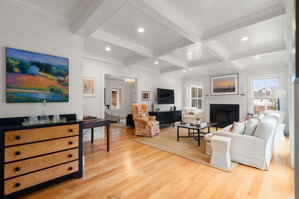 2 Snow Street Sherborn, MA 01770 - Photo 12 of 42 a living room with furniture flat screen tv and a fireplace