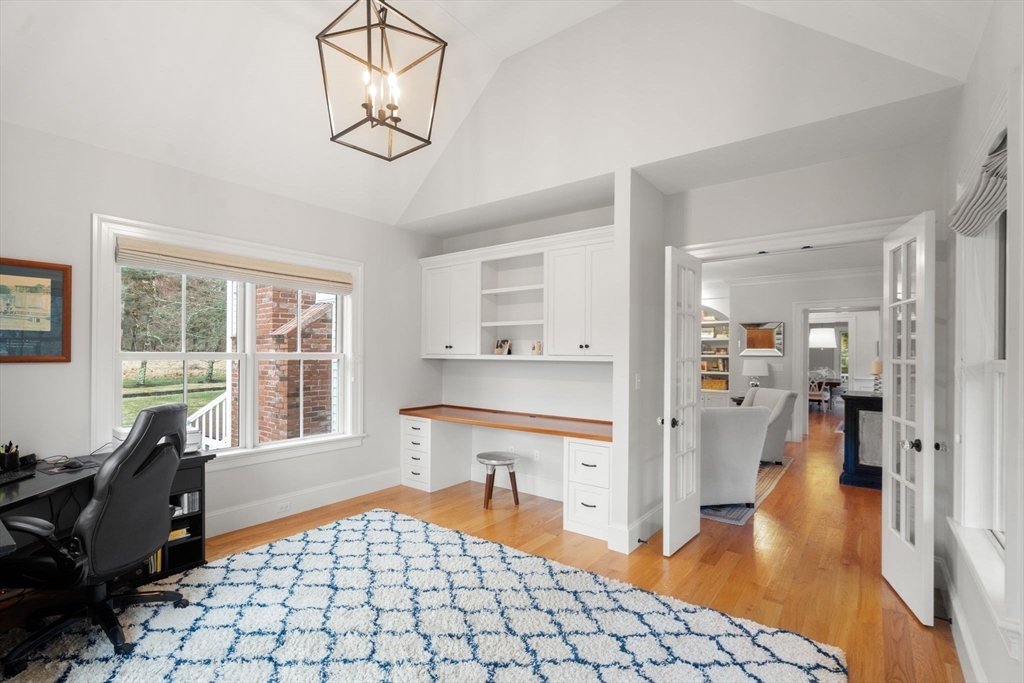 2 Snow Street Sherborn, MA 01770 - Photo 19 of 42 a living room with furniture a flat screen tv and a table