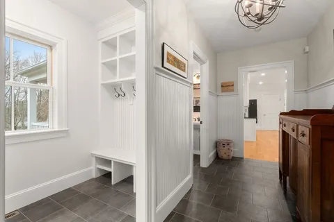 a view of a hallway with closet and utility room