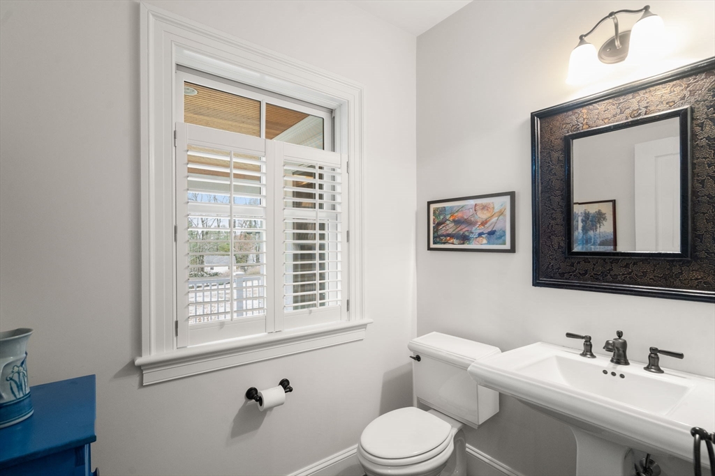 2 Snow Street Sherborn, MA 01770 - Photo 23 of 42 a bathroom with a sink a toilet and a mirror