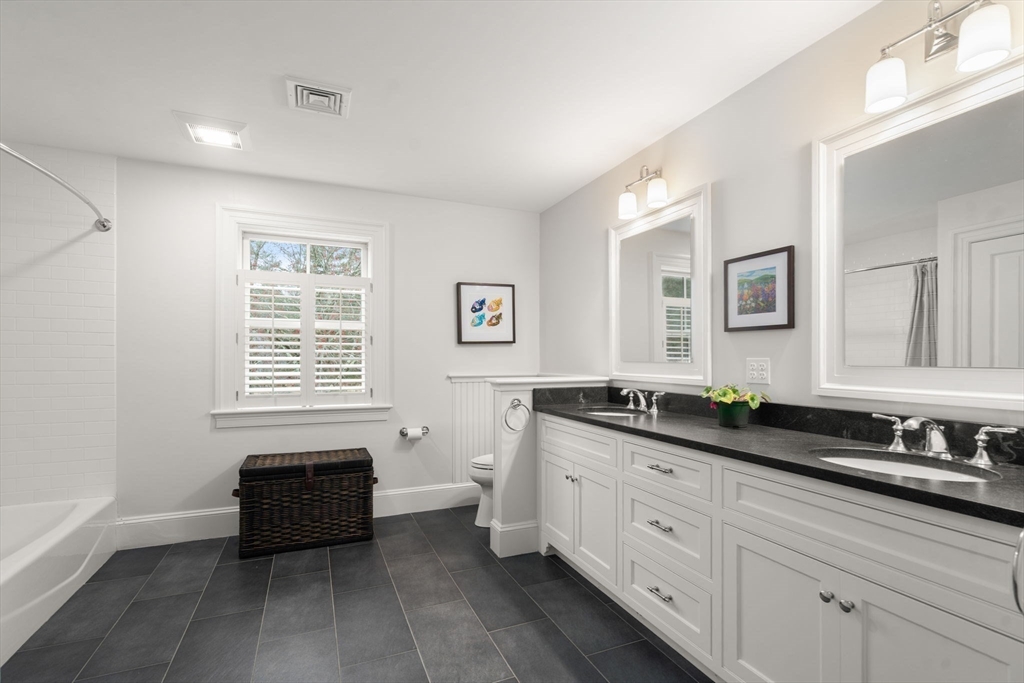 2 Snow Street Sherborn, MA 01770 - Photo 32 of 42 a spacious bathroom with double vanity and a mirror