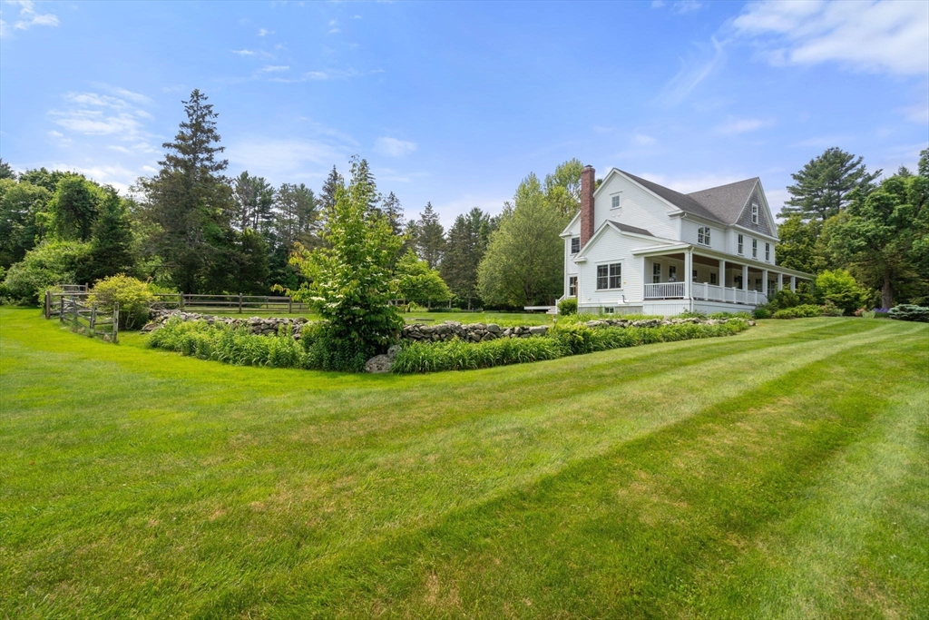 2 Snow Street Sherborn, MA 01770 - Photo 35 of 42 a front view of a house with a garden