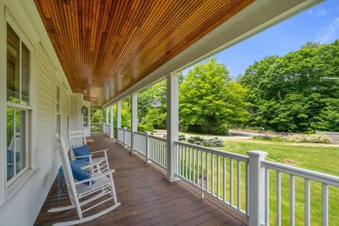 a view of a two chairs in the balcony