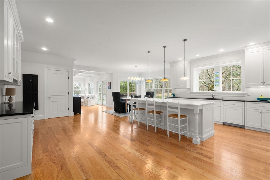 2 Snow Street Sherborn, MA 01770 - Photo 7 of 42 a large white kitchen with lots of counter space wooden floor and appliances