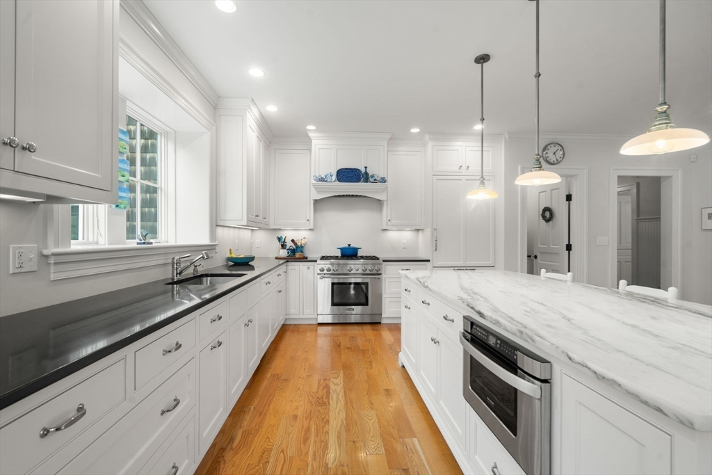 2 Snow Street Sherborn, MA 01770 - Photo 10 of 42 a large kitchen with stainless steel appliances granite countertop a stove a sink and a refrigerator