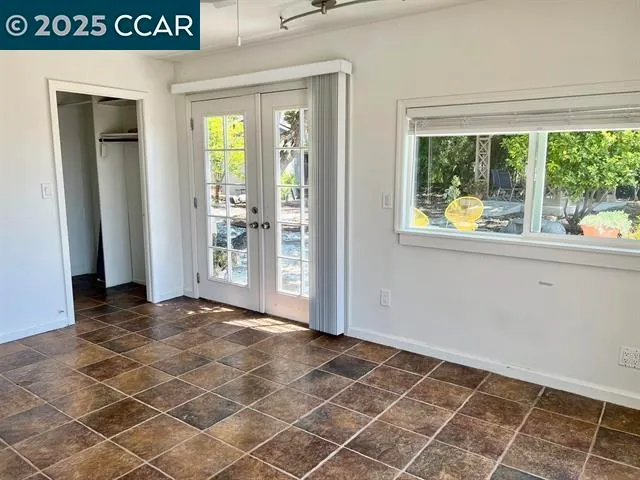 a view of an empty room and window