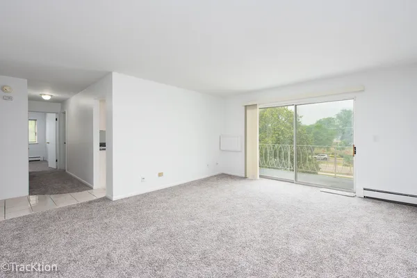 a view of an empty room with a large window