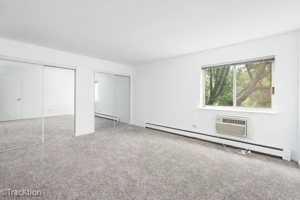 an empty room with a empty space and window