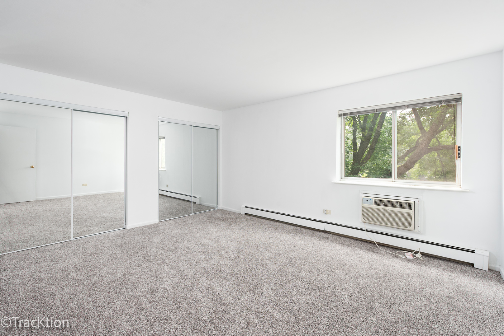 1301 South Finley Road, Unit 311 Lombard, IL 60148 - Photo 7 of 10 an empty room with a empty space and window