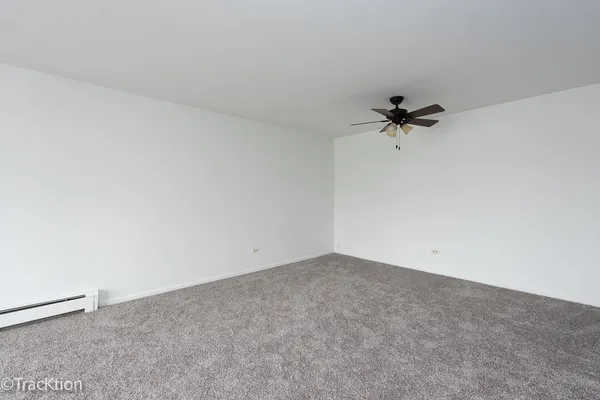 a view of a balcony with wooden fence and floor