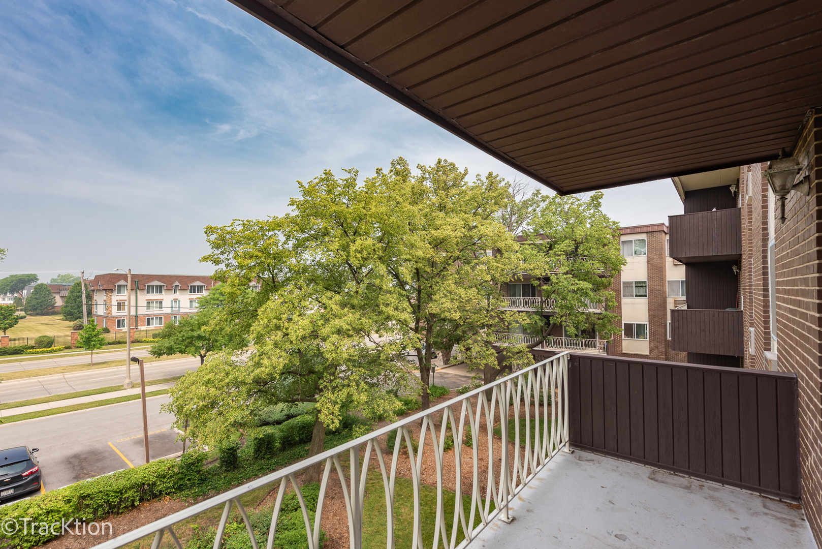1301 South Finley Road, Unit 311 Lombard, IL 60148 - Photo 10 of 10 a view of a balcony with wooden fence and floor