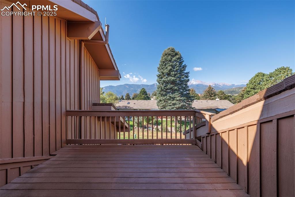 3870 Camels Ridge Lane Colorado Springs, CO 80904 - Photo 20 of 27 a view of balcony with wooden floor