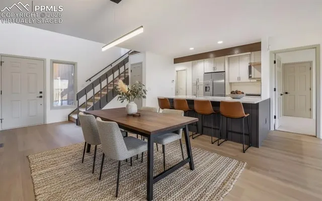 a dining room with a table and chairs