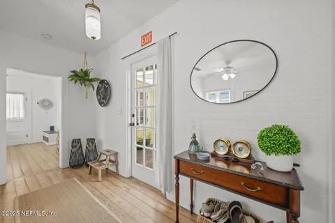 a view of a livingroom with furniture and a window