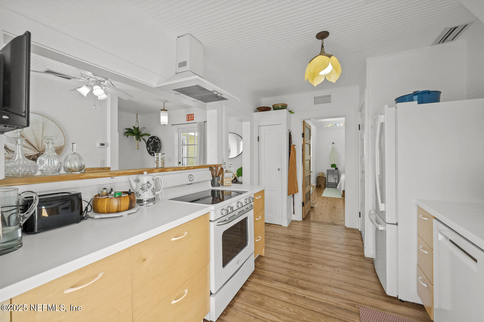 179 Blanco Street St. Augustine, FL 32084 - Photo 18 of 56 a kitchen with a refrigerator and a stove