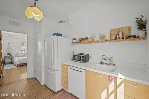 a spacious bedroom with a bed and a window