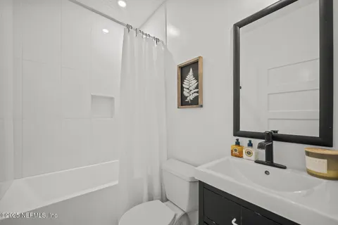 a bedroom with a bed and a table in it