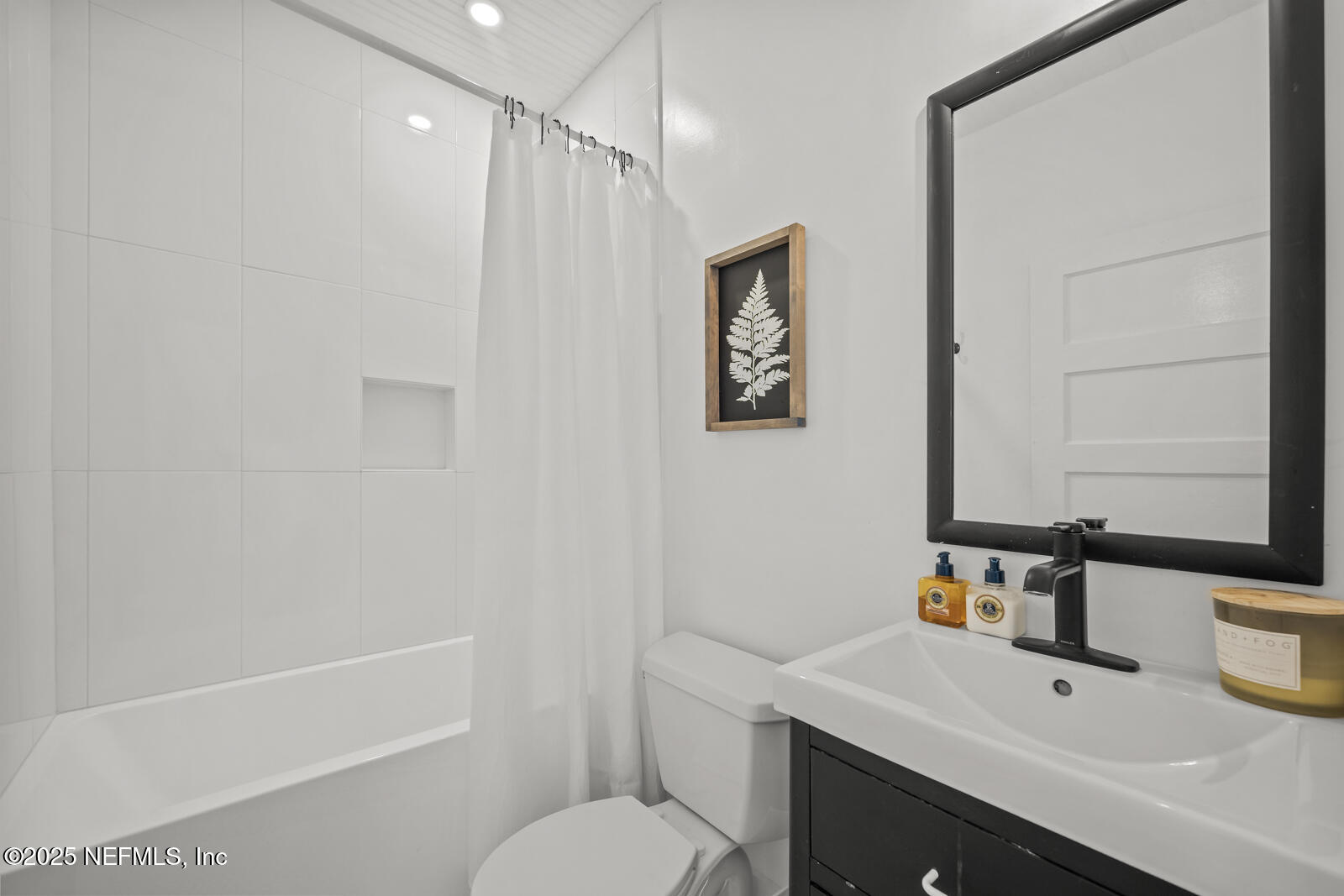 179 Blanco Street St. Augustine, FL 32084 - Photo 25 of 56 a bathroom with a sink a toilet and shower