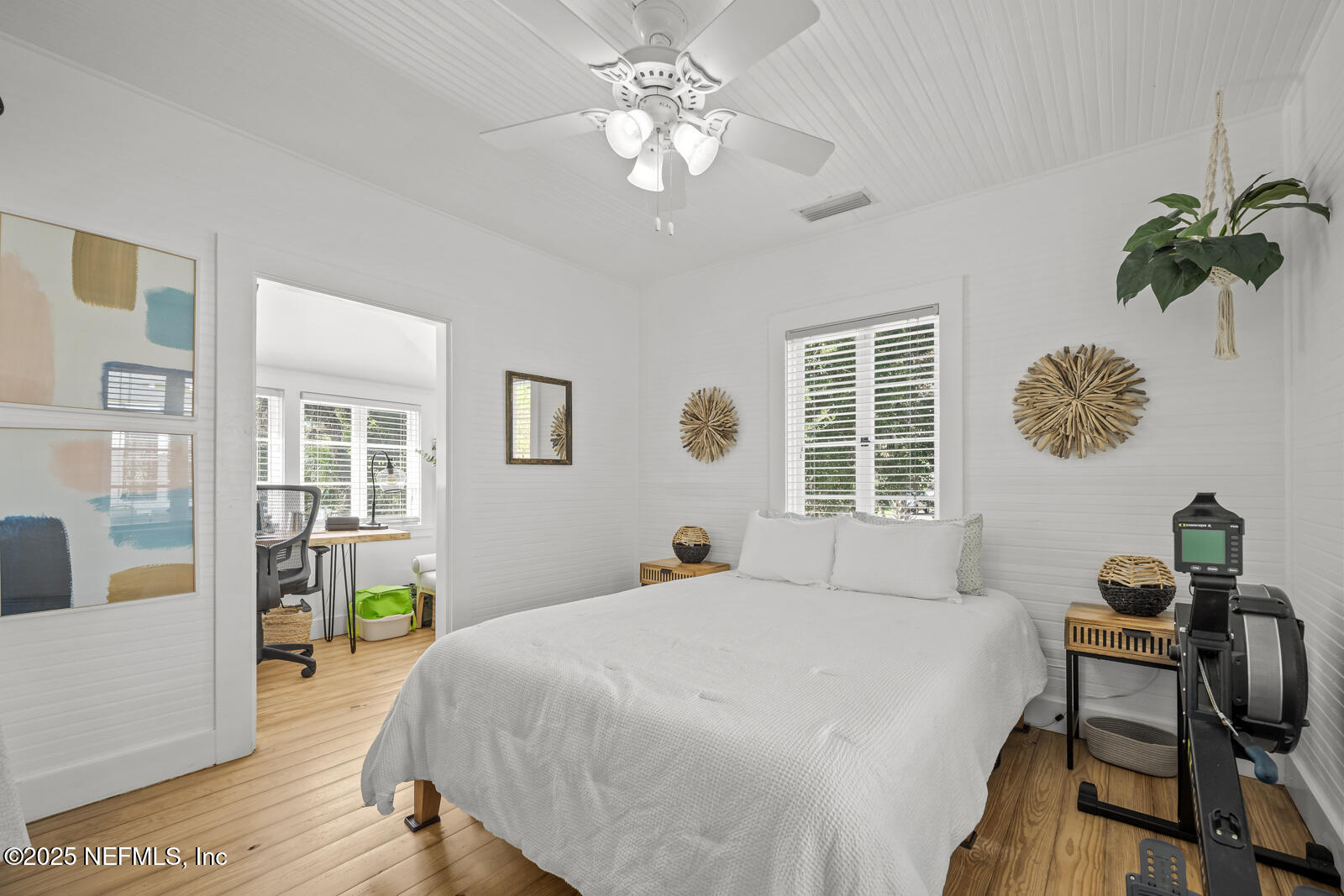 179 Blanco Street St. Augustine, FL 32084 - Photo 27 of 56 a bedroom with a bed and a table in it