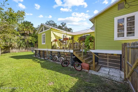 a front view of a house with a yard table and chairs