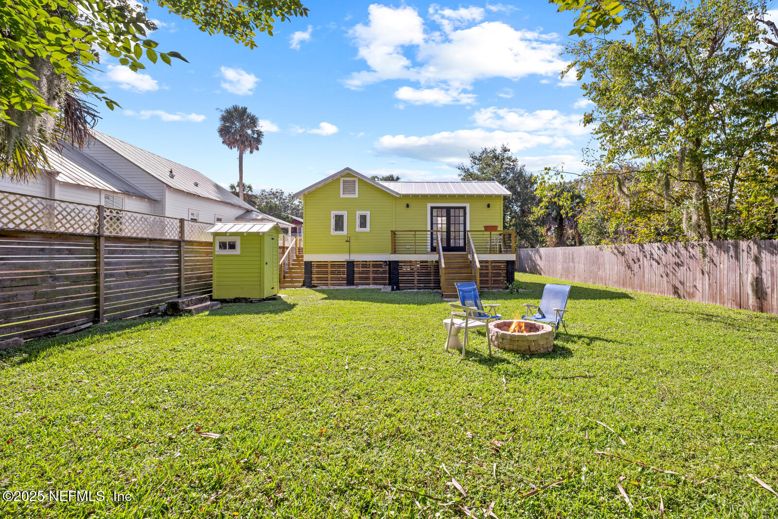 179 Blanco Street St. Augustine, FL 32084 - Photo 36 of 56 a front view of a house with a garden and porch